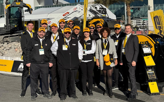 MB Crusher America team experts at Booth O31801 Silver Lot World of Concrete 2026 Las Vegas showing a live demo of MB Crusher Bucket crushing reinforced concrete.